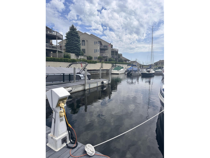 This amazing 32' floating dock boat slip in the very private - Beach Lot for sale in Muskegon, Michigan on Beachhouse.com