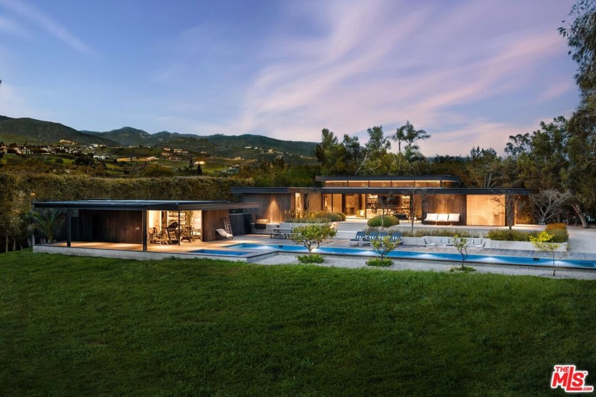 Privately set behind a gated driveway in the prestigious Point - Beach Home for sale in Malibu, California on Beachhouse.com