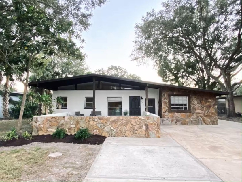 This stunning TURNKEY POOL HOME is perfectly situated across the - Beach Home for sale in Sarasota, Florida on Beachhouse.com