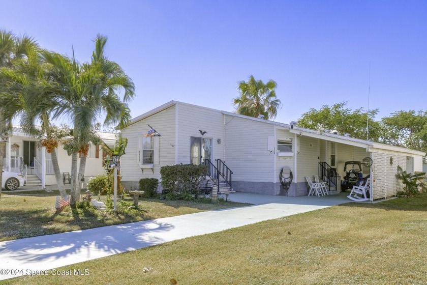 Experience the captivating lifestyle that awaits you in Barefoot - Beach Home for sale in Barefoot Bay, Florida on Beachhouse.com