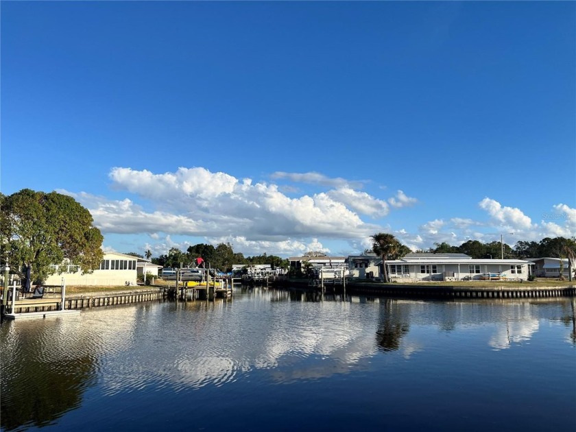 WATERFRONT LIVING!!  This 2 bedroom, 2 bath home has a dock and - Beach Home for sale in St. Petersburg, Florida on Beachhouse.com