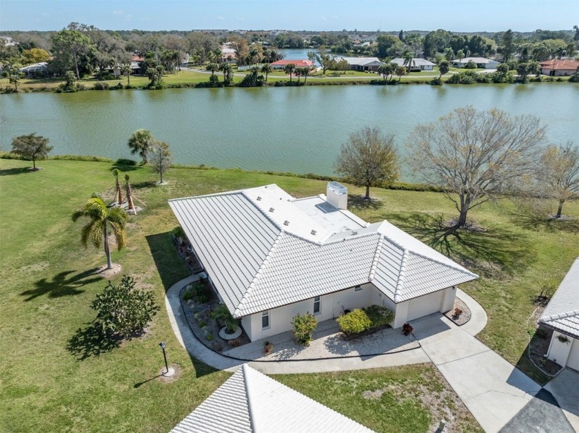 Stunning water views grace this charming 1,402 square-foot - Beach Home for sale in Nokomis, Florida on Beachhouse.com