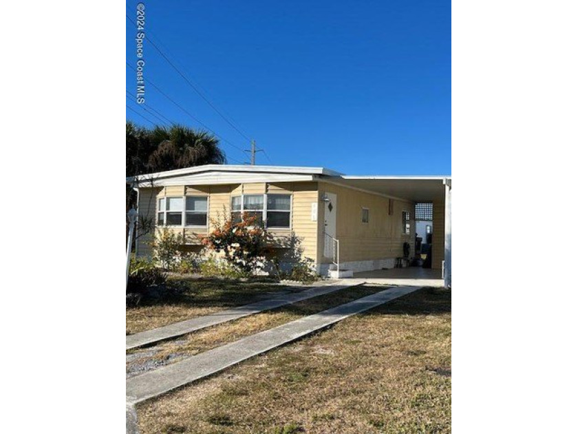 Own your slice of Florida for under $100,000! Manufactured home - Beach Home for sale in Barefoot Bay, Florida on Beachhouse.com