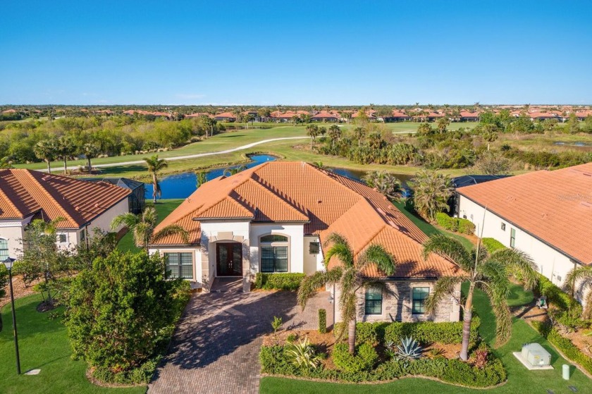 Situated on a premium water lot in the coveted golf community of - Beach Home for sale in Venice, Florida on Beachhouse.com