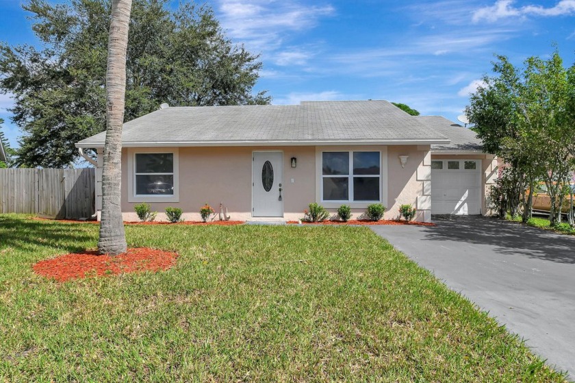 This impressive 4-bedroom, 2-bathroom home boasts a brand new - Beach Home for sale in Lake Worth, Florida on Beachhouse.com