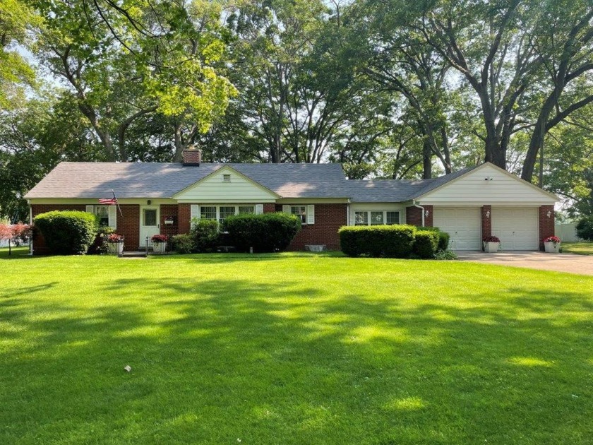 Nestled within the tranquil Roodmont Subdivision, this - Beach Home for sale in Norton Shores, Michigan on Beachhouse.com