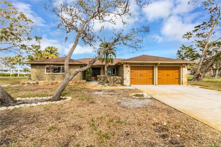 Discover the allure of this classic waterfront home, nestled - Beach Home for sale in Tarpon Springs, Florida on Beachhouse.com