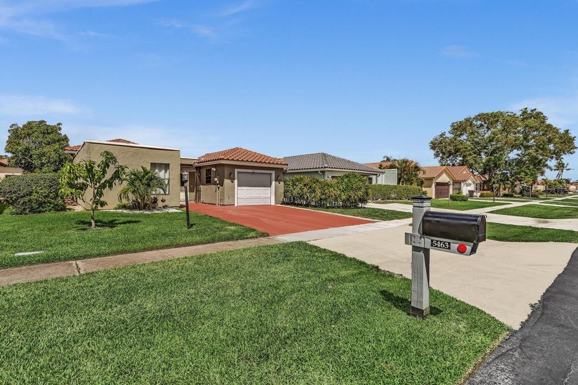 This contemporary home has superb curb appeal with S-Tile roof - Beach Home for sale in Lake Worth, Florida on Beachhouse.com