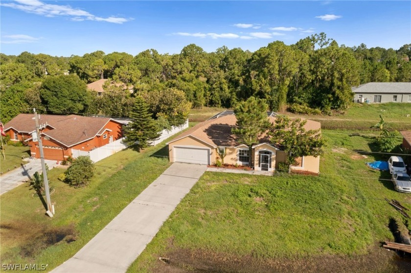 Welcome home to this single-family residence conveniently - Beach Home for sale in Lehigh Acres, Florida on Beachhouse.com