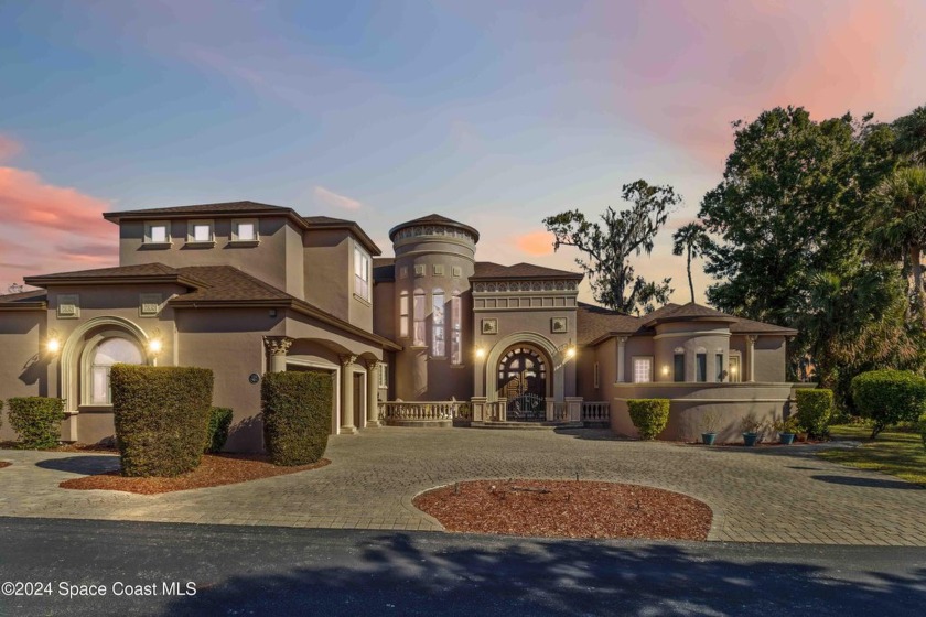 This custom built 4-bedroom, 3.5-bath executive home, nestled on - Beach Home for sale in Titusville, Florida on Beachhouse.com