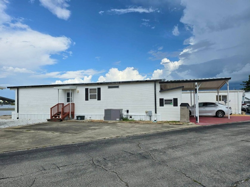 This charming 2-bedroom, 2-bathroom doublewide home offers an - Beach Home for sale in Port Orange, Florida on Beachhouse.com