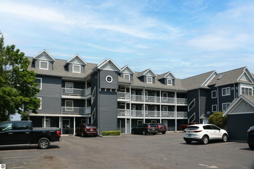 Condo with 200' of shared Grand Traverse Bay waterfront! Fully - Beach Condo for sale in Traverse City, Michigan on Beachhouse.com