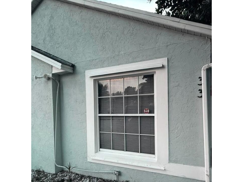 Welcome to 33 Plumage Lane -- a 3 bedroom,2bath home nestled in - Beach Home for sale in West Palm Beach, Florida on Beachhouse.com