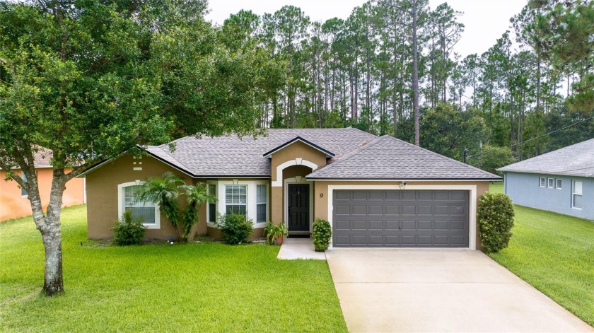 Welcome home! This move-in ready residence is nestled on a - Beach Home for sale in Palm Coast, Florida on Beachhouse.com