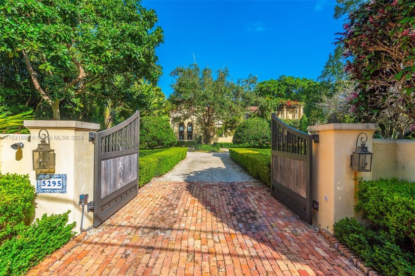Serenely situated on the shores of Hammock Lake 2, this - Beach Home for sale in Coral Gables, Florida on Beachhouse.com