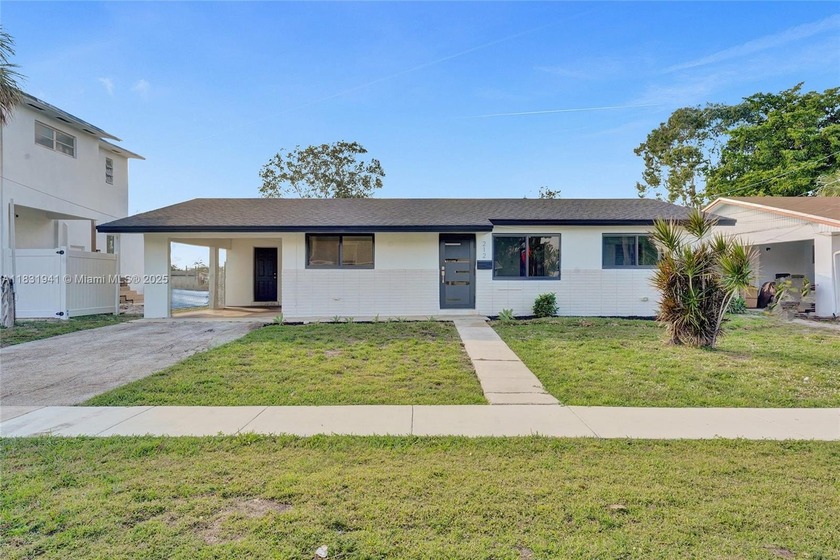 Experience lakefront living in this beautifully upgraded 3BD/2BA - Beach Home for sale in Dania, Florida on Beachhouse.com