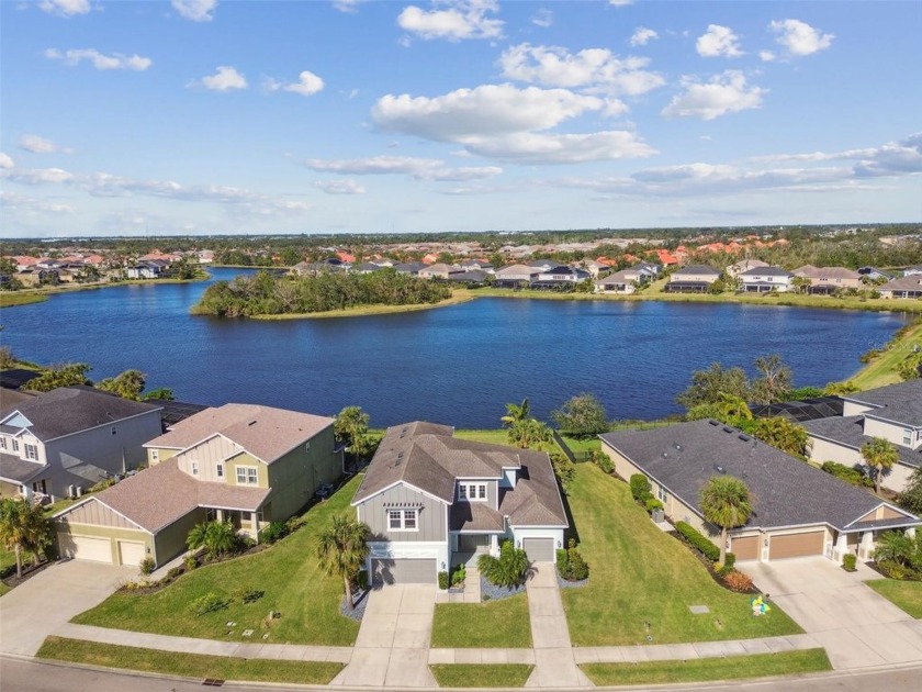 This stunning lakeview home has four bedrooms, and three and a - Beach Home for sale in Sarasota, Florida on Beachhouse.com