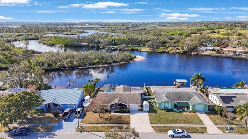 Relax and enjoy this beautiful view from the large screened-in - Beach Home for sale in Holiday, Florida on Beachhouse.com