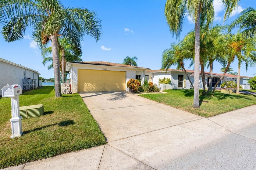 PRIME LAKEFRONT HAVEN-STEP STRAIGHT FROM YOUR PRIVATE BACKYARD - Beach Home for sale in Port Richey, Florida on Beachhouse.com