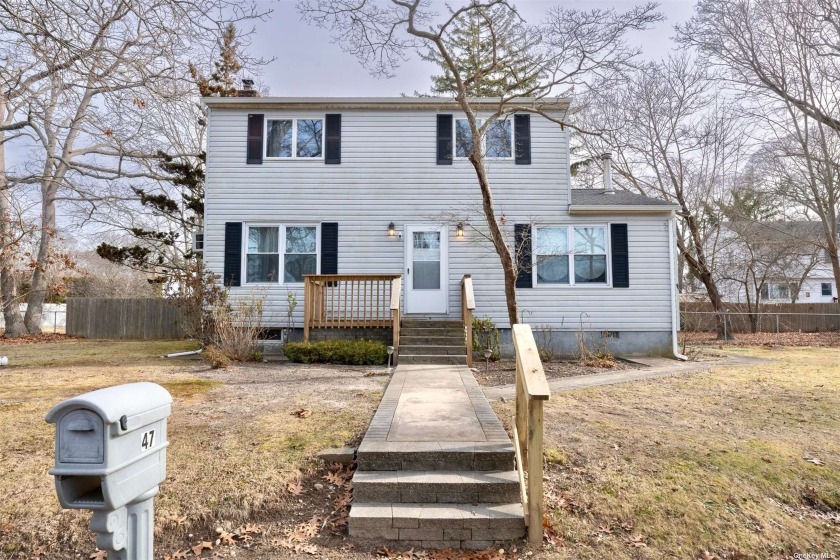 This Spacious Colonial On A Large Corner Lot Is Located In The - Beach Home for sale in Mastic Beach, New York on Beachhouse.com