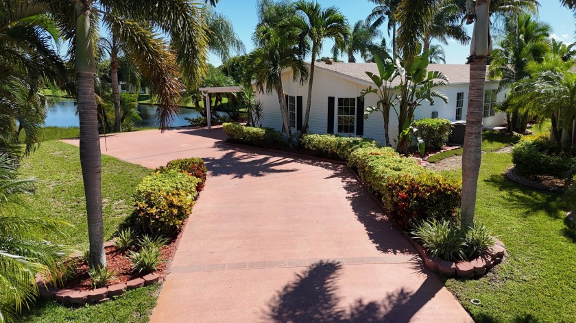 Absolutely stunning and one-of-a-kind corner lot with wraparound - Beach Home for sale in Port Saint Lucie, Florida on Beachhouse.com