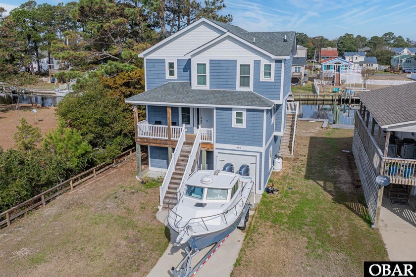 Tucked along a peaceful canal in the sought-after gated boating - Beach Home for sale in Kill Devil Hills, North Carolina on Beachhouse.com