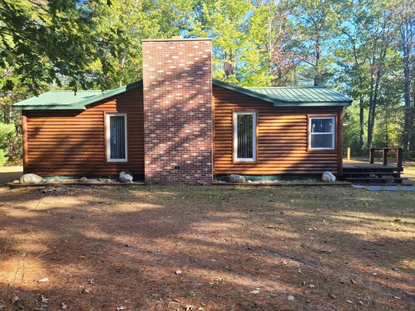 This adorable Cabin/w acreage is located minutes from Lake Huron - Beach Home for sale in Rogers City, Michigan on Beachhouse.com