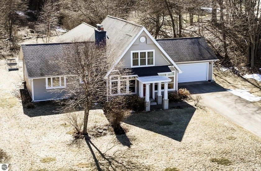 Enjoy stunning sunset views and 480 feet of sandy beach on West - Beach Home for sale in Traverse City, Michigan on Beachhouse.com