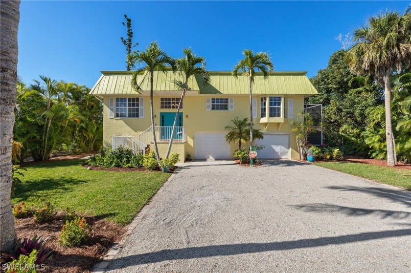 With beautiful views of the Gulf access canal, this elevated - Beach Home for sale in Sanibel, Florida on Beachhouse.com
