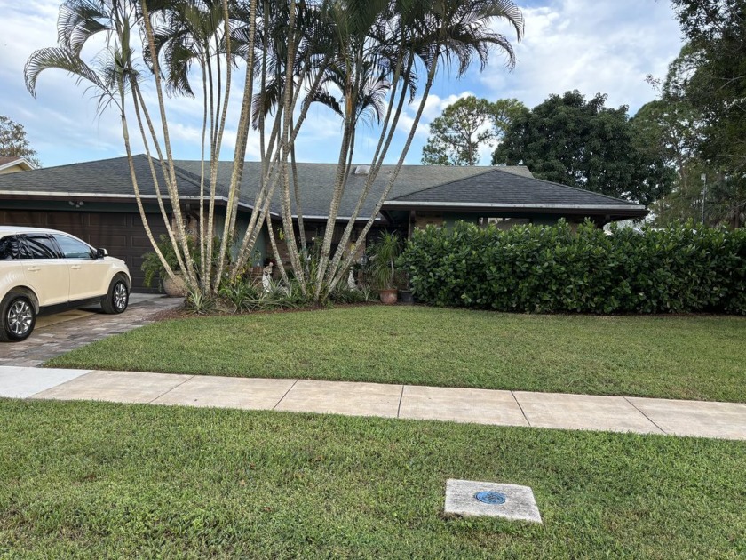 This 4 bedrooms 2 baths home with a pool is perfectly located in - Beach Home for sale in Wellington, Florida on Beachhouse.com