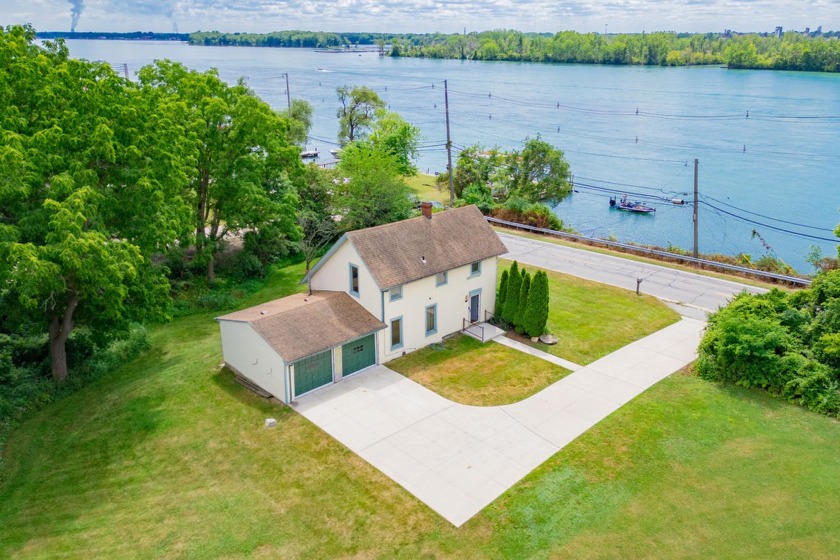 Offered is a historic farm house in the most desirable location - Beach Home for sale in Grosse Ile, Michigan on Beachhouse.com