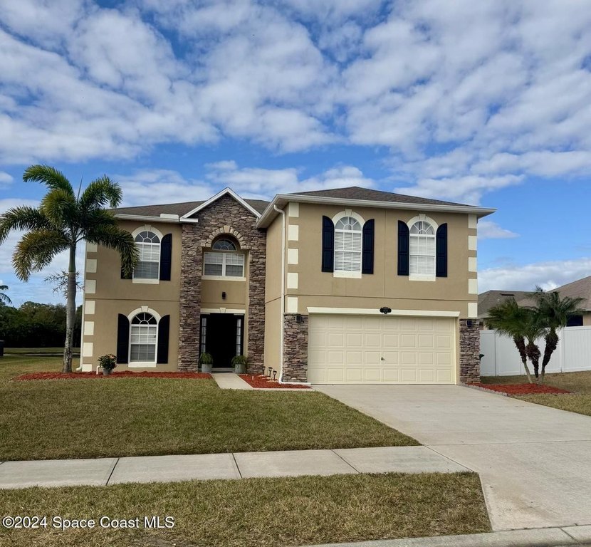 Stunning lakefront two stories single family home in the very - Beach Home for sale in Cocoa, Florida on Beachhouse.com