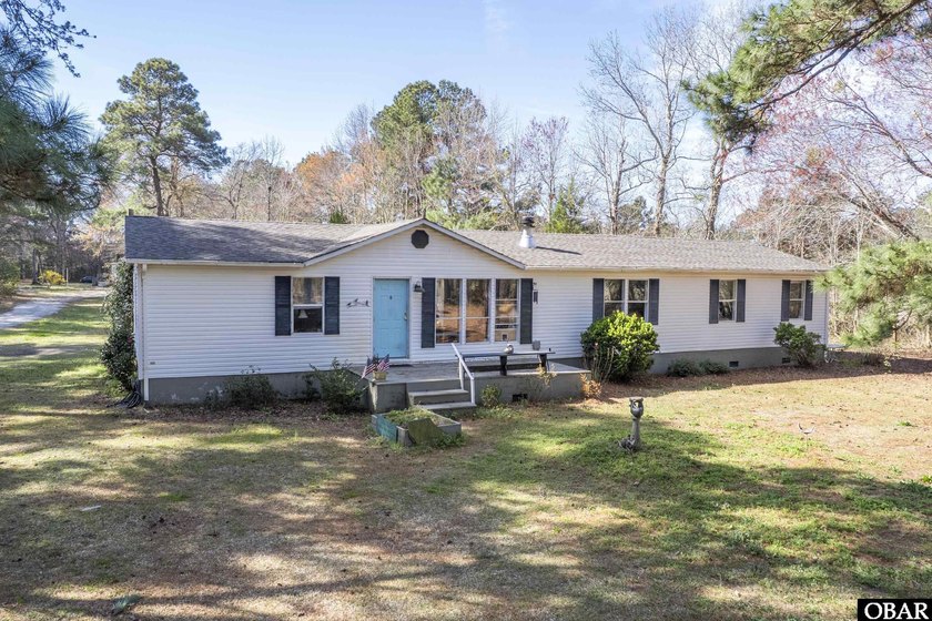 Enjoy quiet living on a spacious lot within minutes to beaches - Beach Home for sale in Powells Point, North Carolina on Beachhouse.com