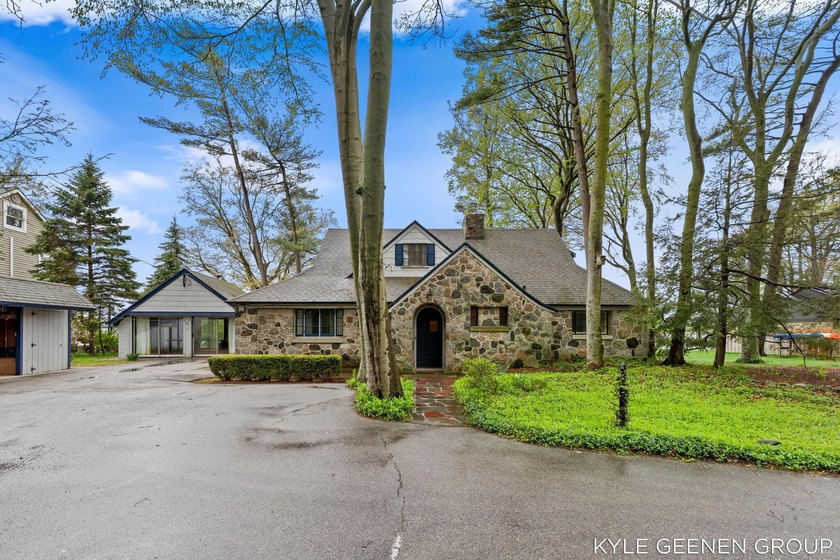 Welcome to 1418 Waukazoo Drive, a rare opportunity to enjoy the - Beach Home for sale in Holland, Michigan on Beachhouse.com