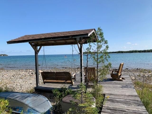 Quiet, pristine setting on Lake Huron.  A wall of windows - Beach Home for sale in Presque Isle, Michigan on Beachhouse.com