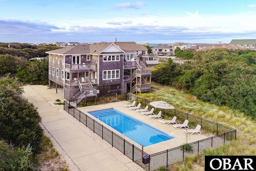 Tucked beneath a canopy of mature live oaks on a quiet oceanside - Beach Home for sale in Southern Shores, North Carolina on Beachhouse.com