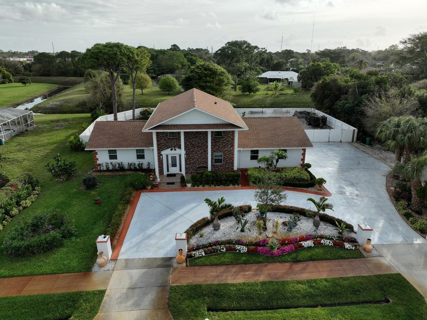 Welcome to a captivating Southern Colonial-style estate that - Beach Home for sale in Port Saint Lucie, Florida on Beachhouse.com