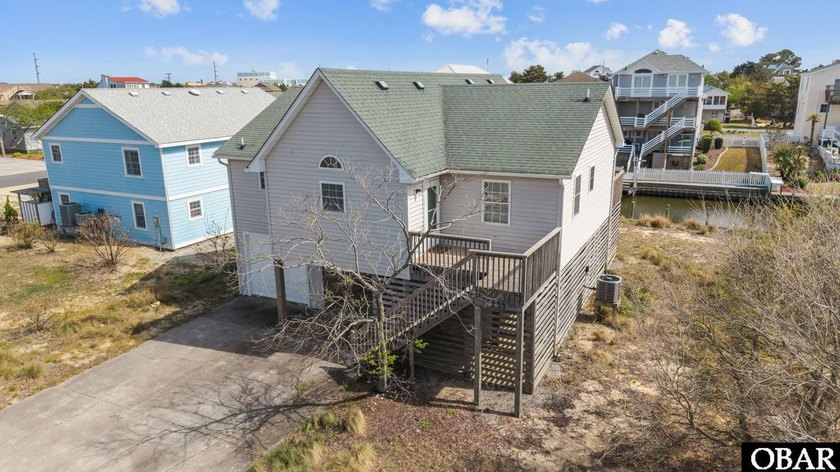 Waterfront Living in Old Nags Head Cove! Discover this bright - Beach Home for sale in Nags Head, North Carolina on Beachhouse.com