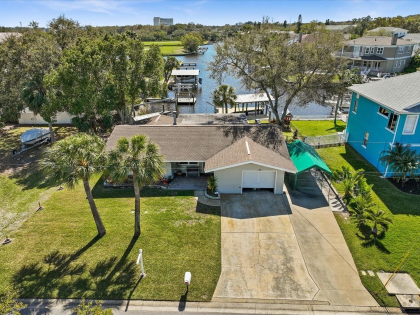 Experience the epitome of Florida waterfront living in this - Beach Home for sale in Tarpon Springs, Florida on Beachhouse.com