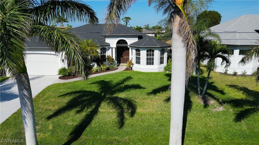 OWN A PIECE OF PARADISE! . . . Step through the front doors and - Beach Home for sale in Cape Coral, Florida on Beachhouse.com