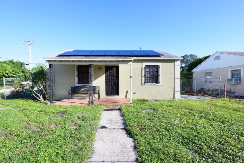 Welcome to this charming corner lot gem with modern upgrades! A - Beach Home for sale in Riviera Beach, Florida on Beachhouse.com