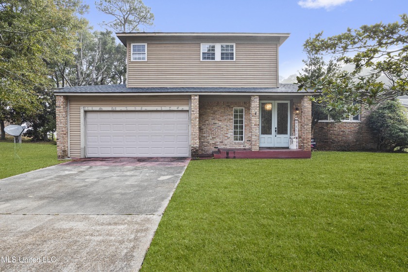 Welcome home to this stunning waterfront retreat offering the - Beach Home for sale in Gautier, Mississippi on Beachhouse.com