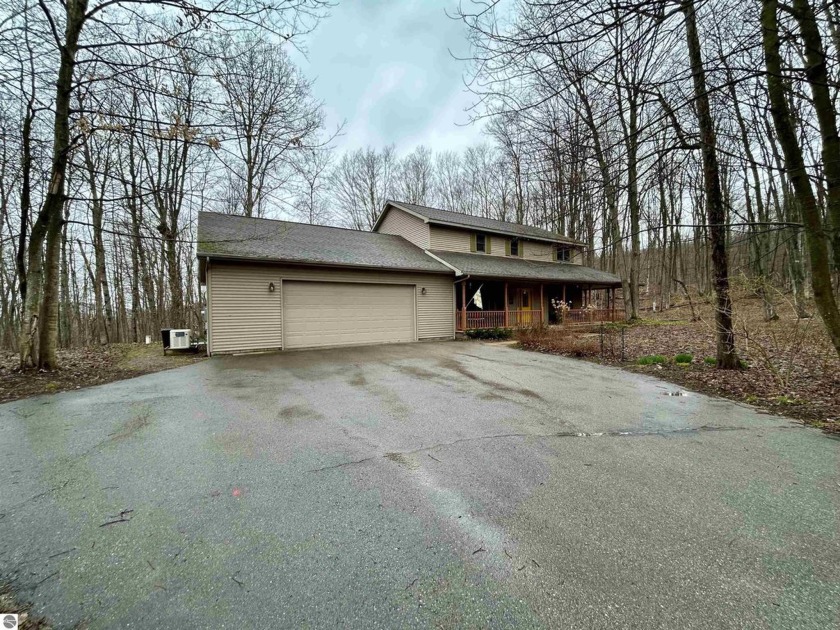 Beautiful four bedroom, three full bathroom home nestled on 10 - Beach Home for sale in Maple City, Michigan on Beachhouse.com