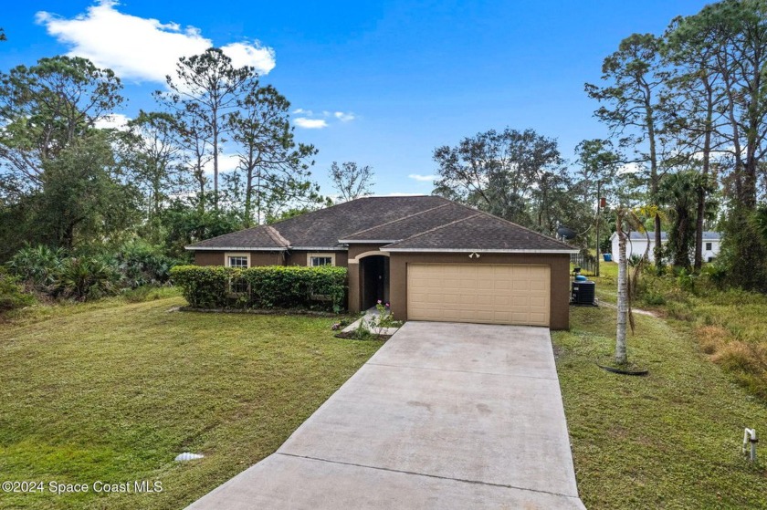 Discover this charming one-story home conveniently located in - Beach Home for sale in Palm Bay, Florida on Beachhouse.com