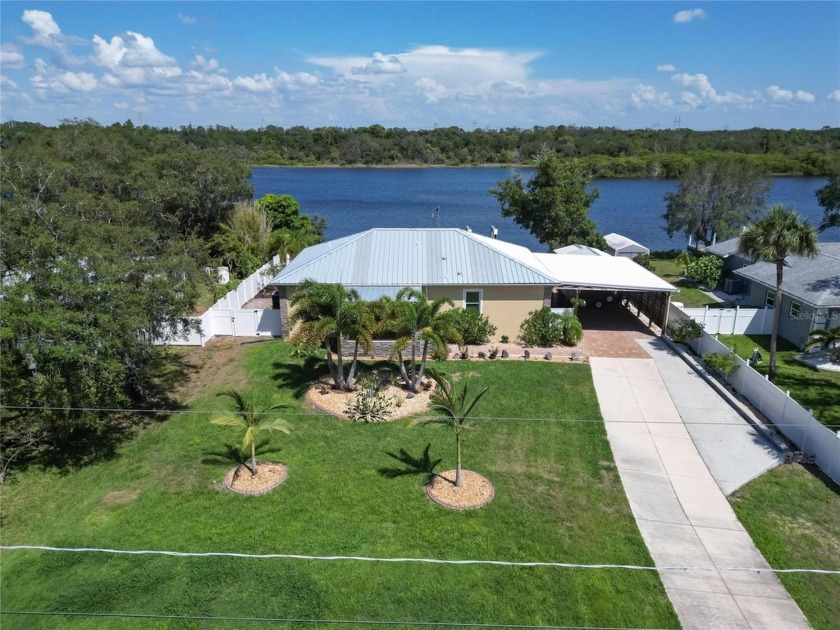Your opportunity to own this WATERFRONT gem has arrived, nestled - Beach Home for sale in Ruskin, Florida on Beachhouse.com