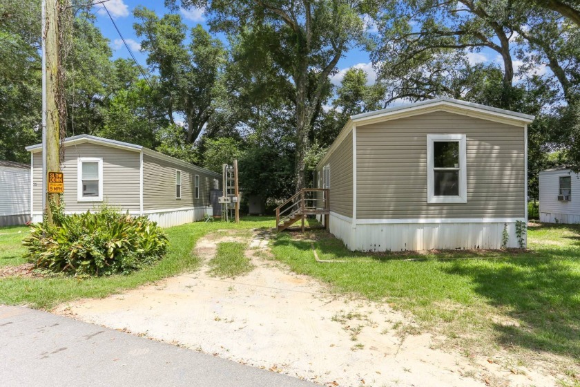 (Espanol a continuacion) ONE MONTH FREE LOT RENT - This stunning - Beach Home for sale in Pensacola, Florida on Beachhouse.com