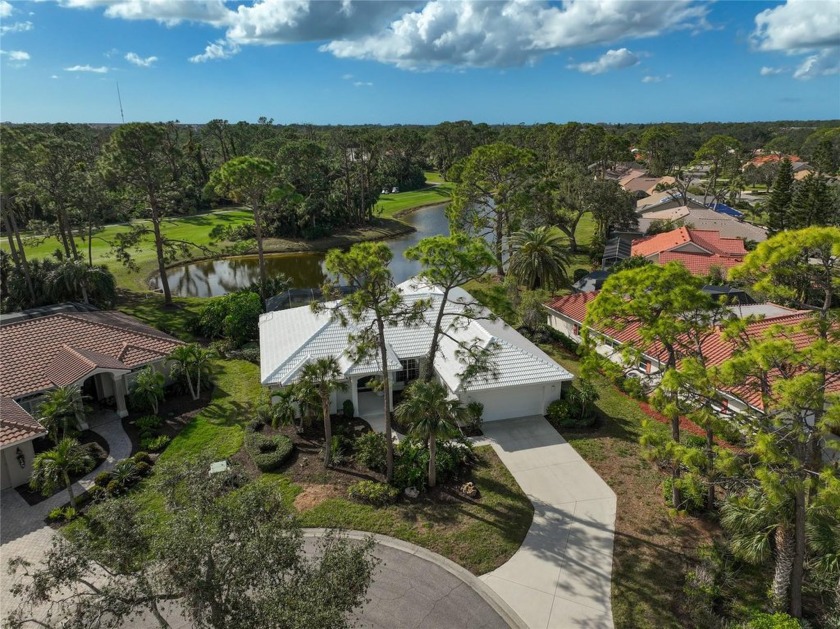 Wake up to stunning lakefront views in this remarkable Calusa - Beach Home for sale in Nokomis, Florida on Beachhouse.com