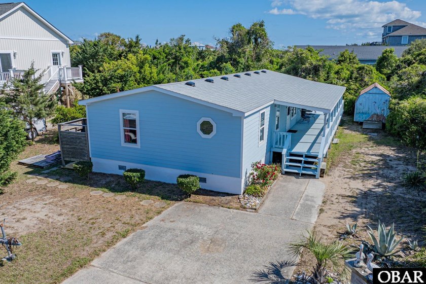 Tucked away on a quiet cul-de-sac in the heart of Waves, this - Beach Home for sale in Waves, North Carolina on Beachhouse.com