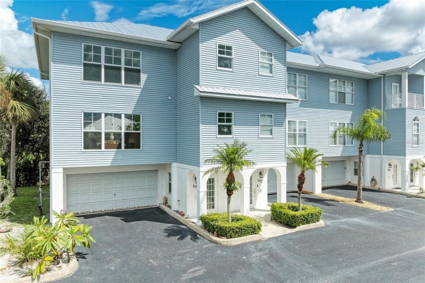 Discover this beautifully remodeled three-story end unit - Beach Townhome/Townhouse for sale in Rotonda West, Florida on Beachhouse.com