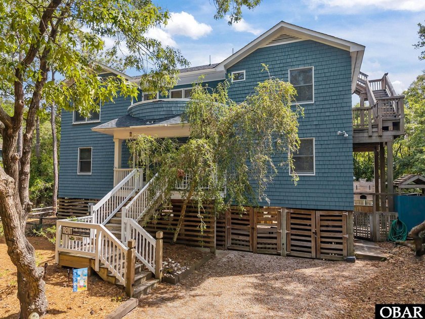 Tucked beneath a canopy of majestic live oaks on a quiet, shady - Beach Home for sale in Southern Shores, North Carolina on Beachhouse.com
